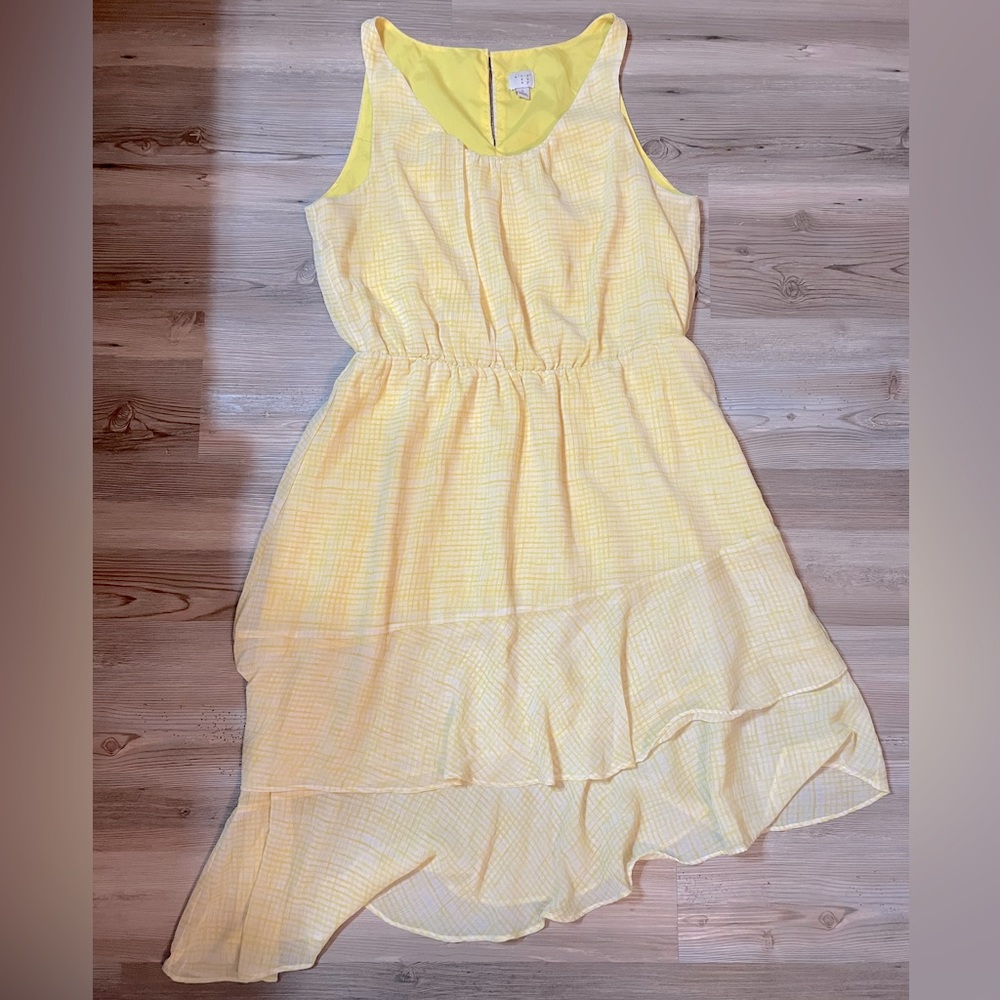 Yellow sleeveless sundress with angled bottom